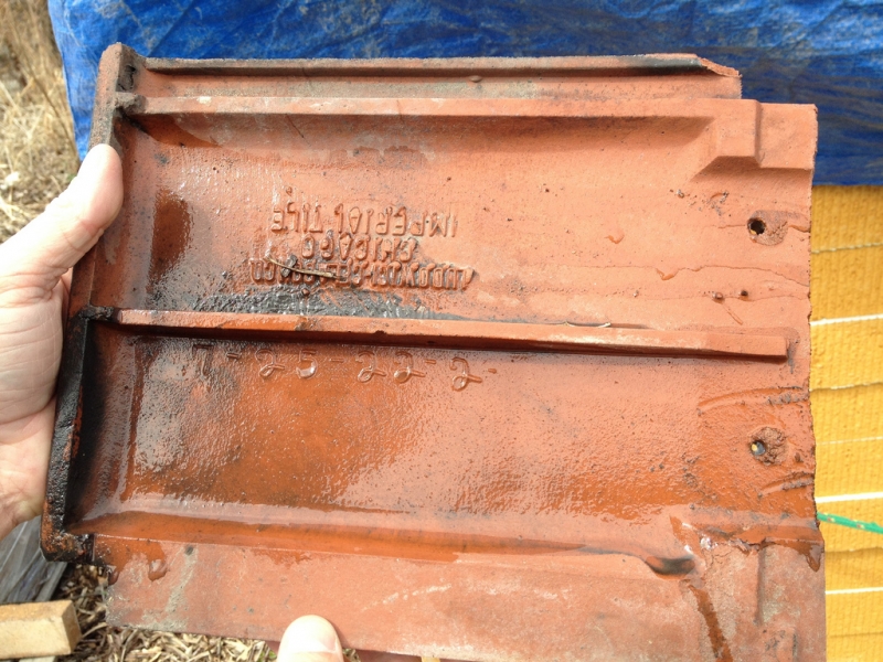 A clay tile from a Boston-Edison home that will be used for our greenhouse roof dates back to 1922.