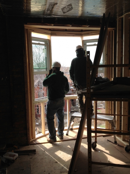 Monahan Brothers Construction working on the bay windows.