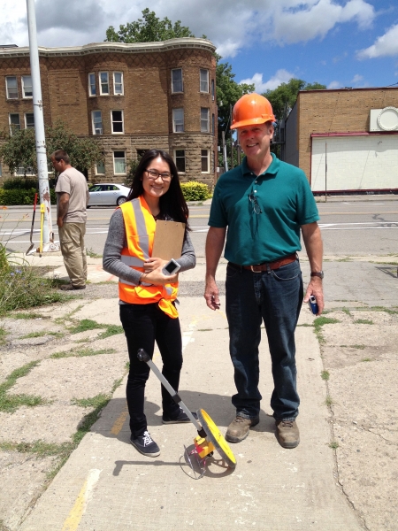 Joe Gallagher with Ana Navarrete, an engineer with Giffels Webster, who is helping with the design of the alley behind the building.