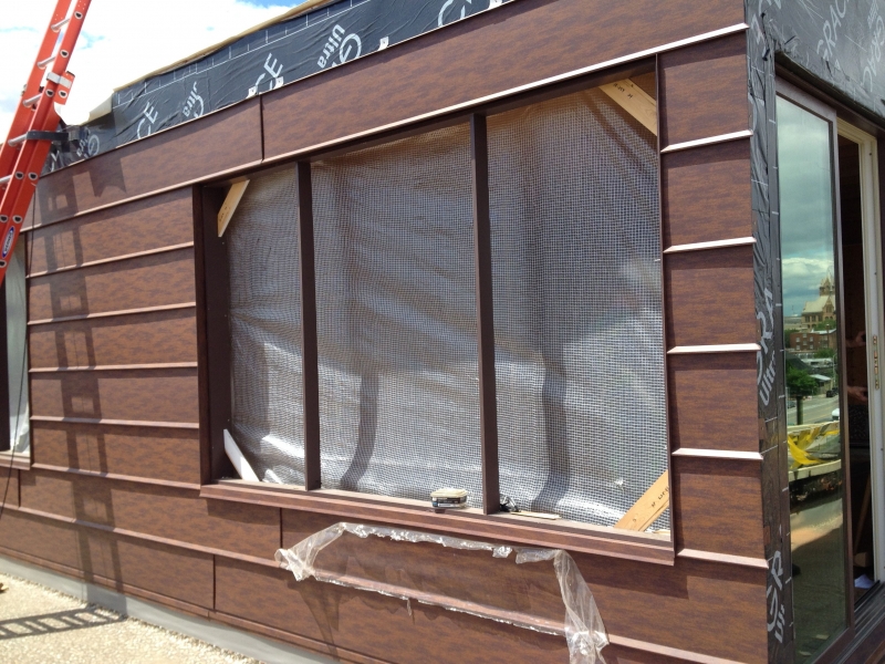 New weatherized metal siding for the rooftop cabins.