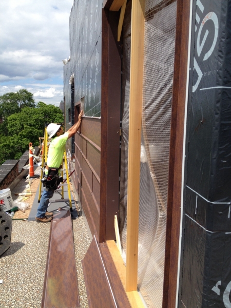 Putting up the siding on the rooftop cabins. It's COR-TEN AZP weatherized metal.