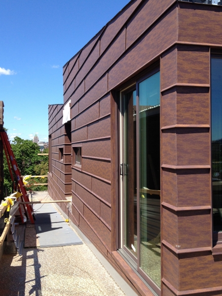 The cabins' metal siding is in place.