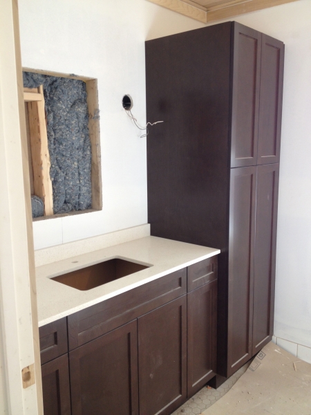Bathroom with cupboards and countertop