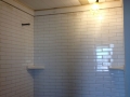 Bathroom tile and planked ceiling