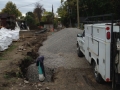 Adding gravel for drainage in the alley