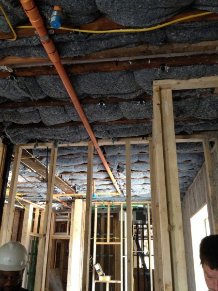 The blue jean insulation will keep the building warm, insulate sound, and its a much safer product to install.