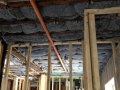 The blue jean insulation will keep the building warm, insulate sound, and its a much safer product to install.