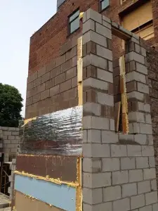 Insulation applied to elevator tower.