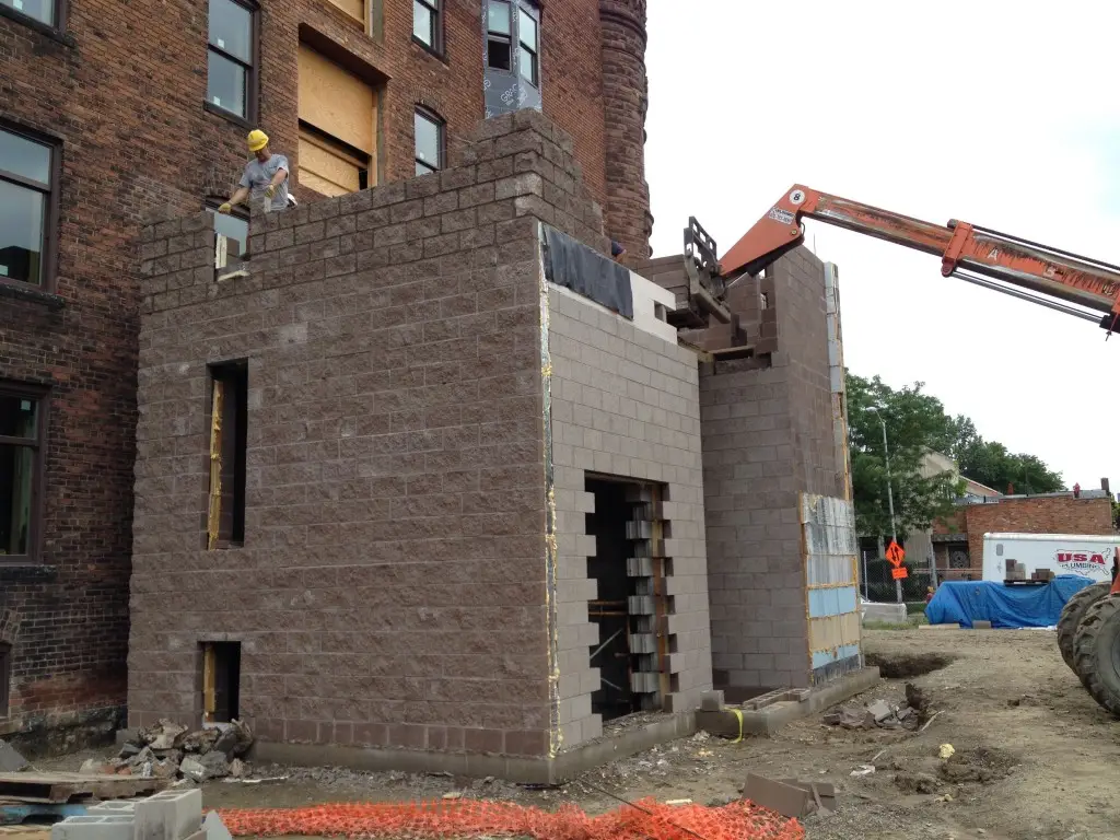 Building out the elevator tower to the second floor level.