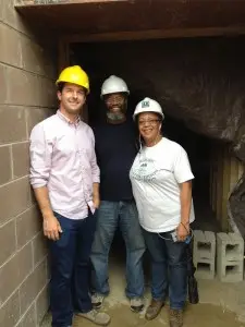 Pam and Keith Owens and Jason Peet at the elevator entrance to the basement.